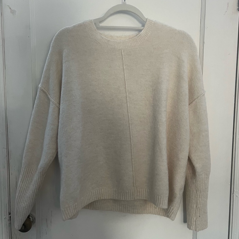 Crème colored women’s crew neck sweater